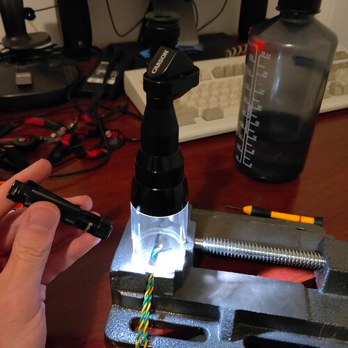 microscope posed over wire