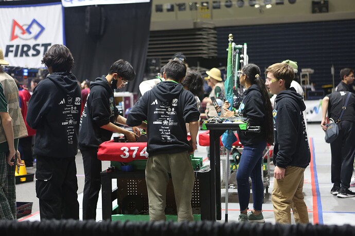 Alex (left) and Ace (right) checking the robot before a playoff match at SDR